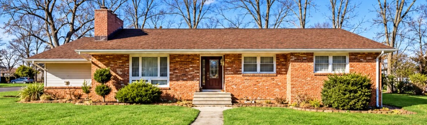 Advertiser-supplied front exterior photograph of the brick home at 603 Carol Avenue, Oakhurst.