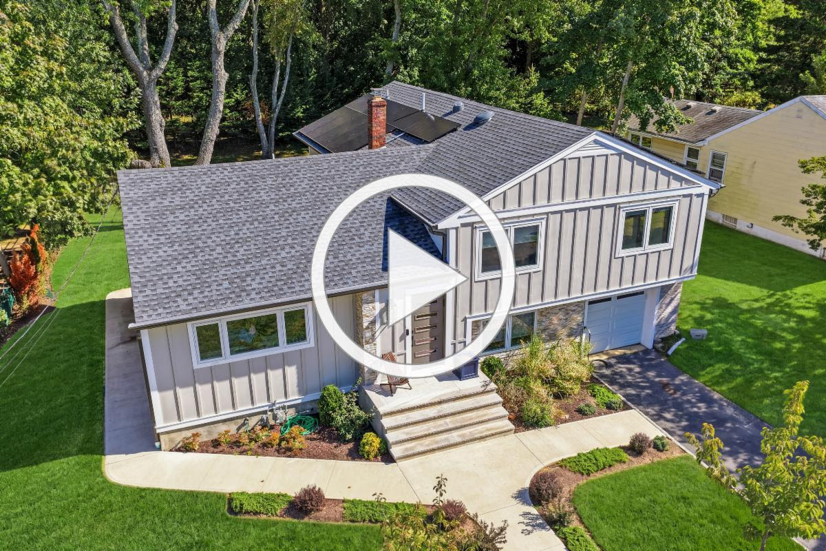 Static exterior preview of 11 Nolan Drive from the supplied campaign. The play symbol is part of the image, not a video player.